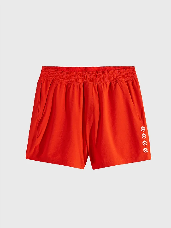 LULULEMON SOLAR ORANGE PACE BREAKER LINERLESS 5IN SHORT